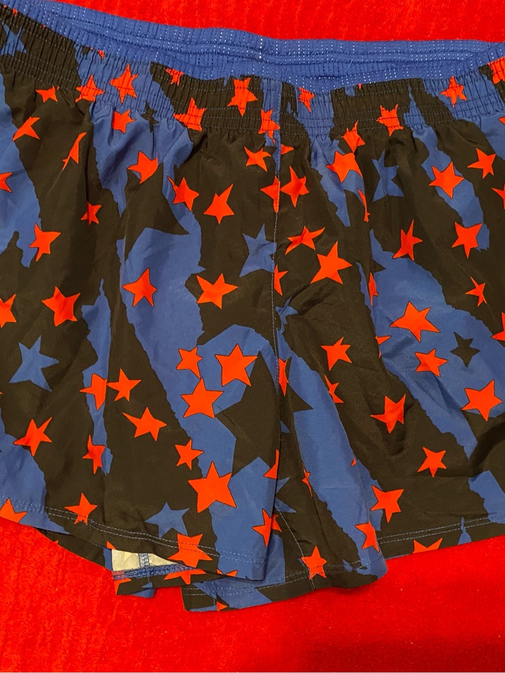 Nike Black and Blue Athletic Shorts with Red Star Print